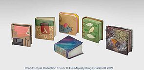 Frontansichten von sechs neuen Miniatur-Büchern